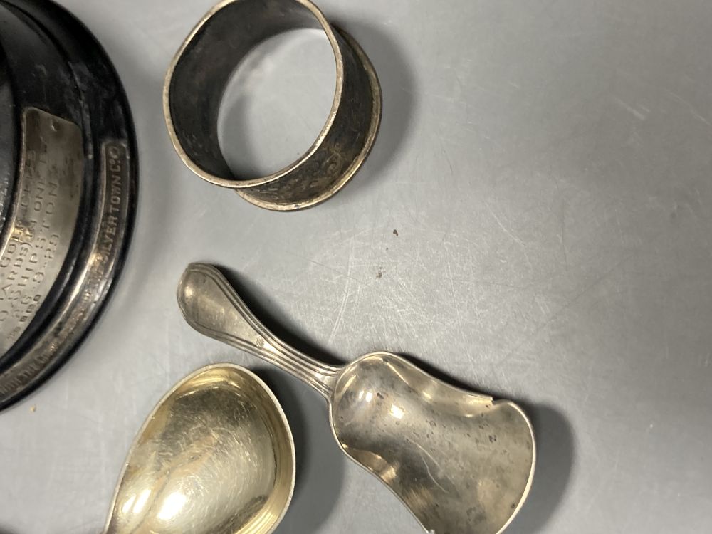 Two 19th century caddy spoons, silver napkin ring, a pair of Continental white metal servers and a golf trophy
